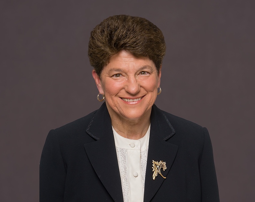 Ellen_C._Kearns seen wearing a white color tshirt and a black color suit